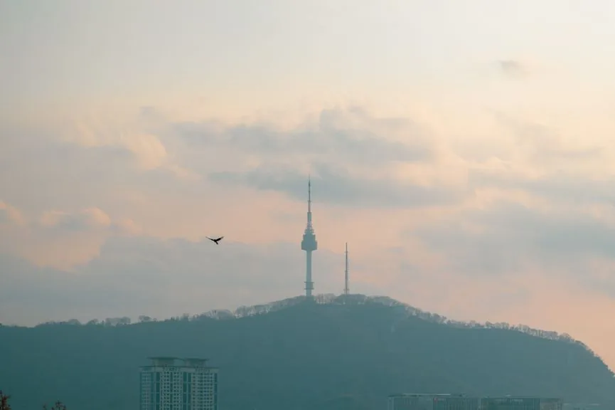 N Seoul Tower on Namsan under a hazy pink sky